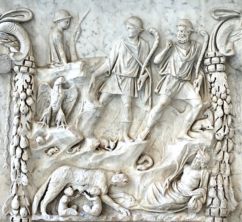 Representation of the lupercal: Romulus and Remus fed by the she-wolf, Lupa, surrounded by representations of the Tiber and the Palatine. Panel from an altar dedicated to the divine couple of Mars and Venus. Marble, Roman artwork of the end of the reign of Trajan (98-117 CE), later re-used under the Hadrianic era (117-132 CE) as a base for a statue of Silvan. From the portico of the Piazzale dei Corporazioni in Ostia Antica. Shown in museum of Palazzo Massimo alle Terme (Rome).