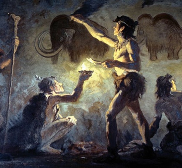 Paleolithic men paint inside a cave