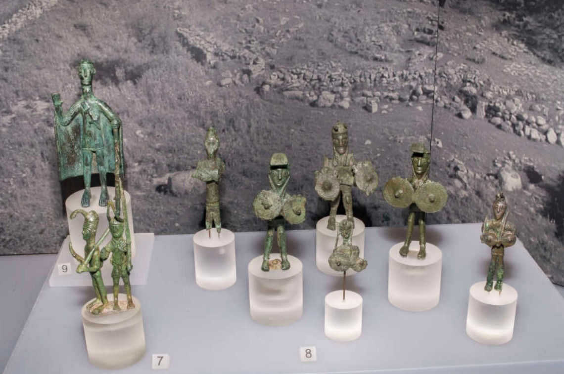 Group of bronzes (X-VII century BC) coming from Abini and depicting characters of the nuragic community: <b>soldiers in pairs</b> caught in the act of prayer and characterized by helmets surmounted by long horns (7); <b>heroic warriors</b> to which multiply some parts of the body, such as eyes and arms or shields, are exactly similar to those found in the Middle East (8); <b>tribal leaders</b> (9) - (National Archaeological Museum in Cagliari)