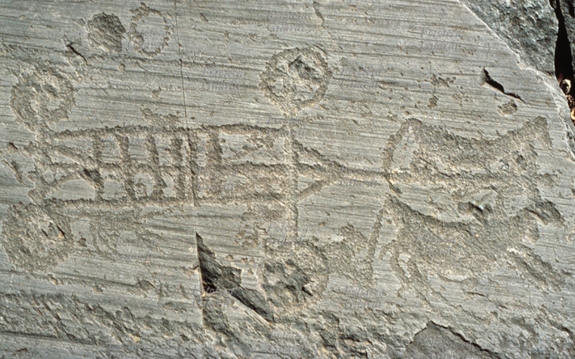 An engraving depicting a four-wheeled cart pulled by equidae (Iron Age, first half of the first millenium BCE), Valcamonica