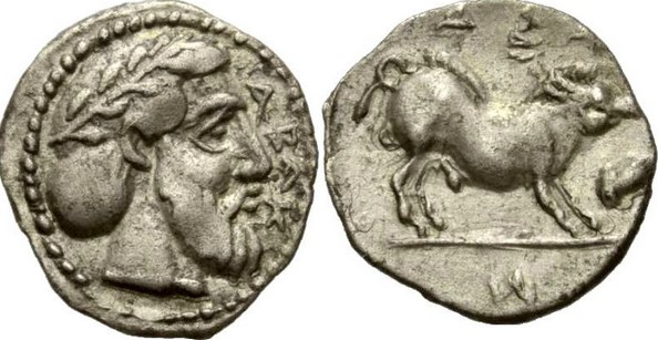 A coin of the ancient city of Abacaenum. Litra, ca. 440-435 BC; ABAK, laureate and bearded male head r., Rv. AI - NI (around), boar standing r.; below, acorn.